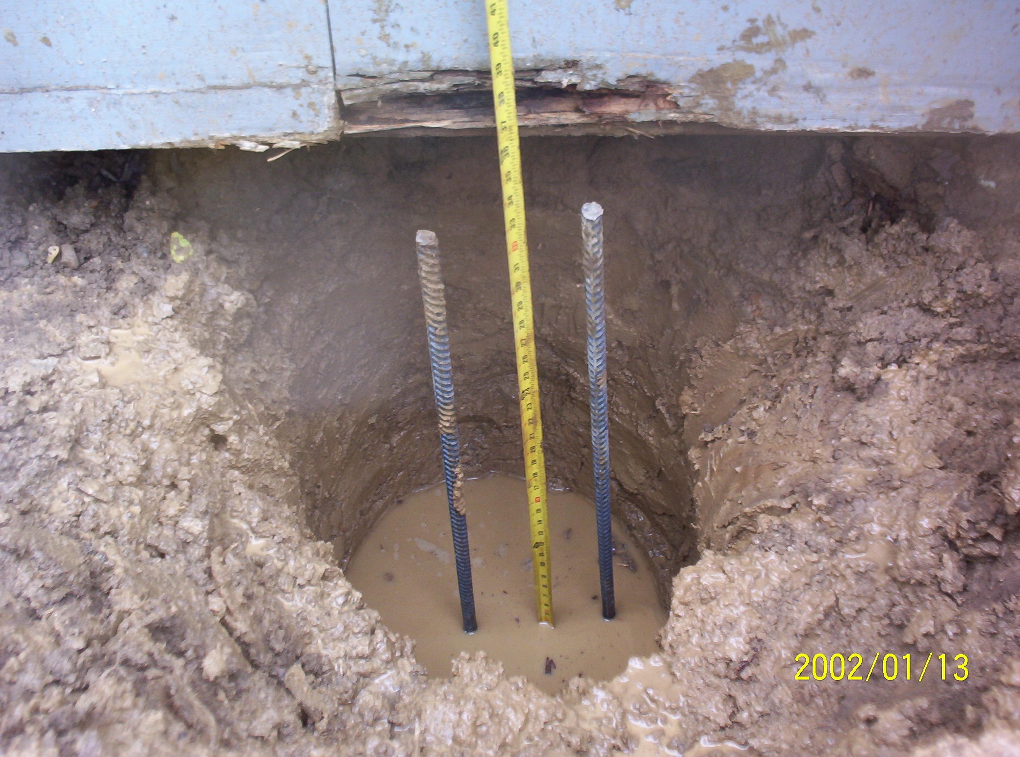 CUTE HOUSE SAVED WITH CONCRETE POST HOLES